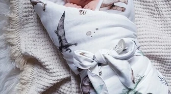 Rożek czy otulacz? Co wybrać dla noworodka? Poznaj Qbana Mama